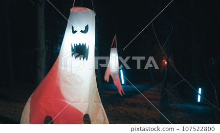 Ghost hanging from a tree in the night 107522800