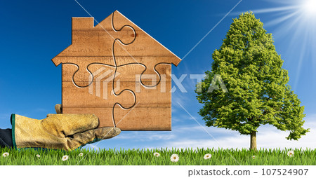 Gloved Hand Holding a Wooden House Made of Puzzle Pieces Gloved Hand Holding a Wooden House Made of Puzzle Pieces 107524907