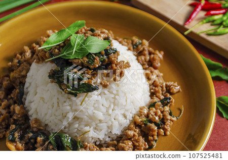 Minced pork with basil over rice is a Thai food that is popular among Thai people  107525481