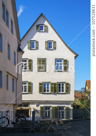 white house with shutters 107528631