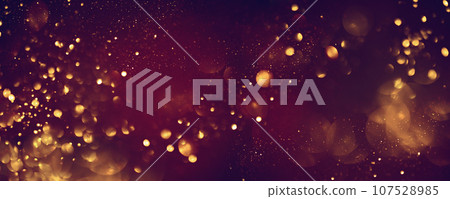 Golden abstract bokeh on black background. 107528985