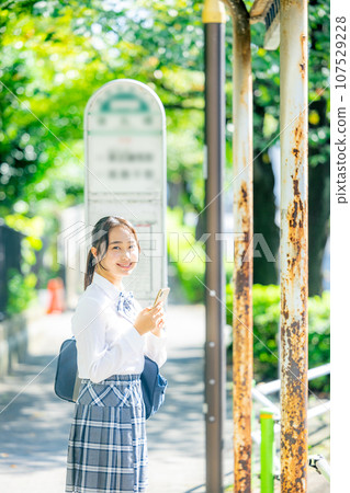 High school girl operating a smartphone 107529228
