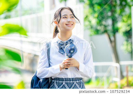 High school girl with a fan 107529234