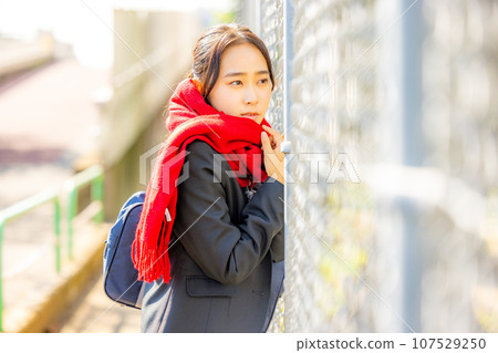 High school girl wearing a muffler in winter 107529250