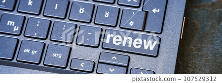 computer keyboard with the word renew 107529312