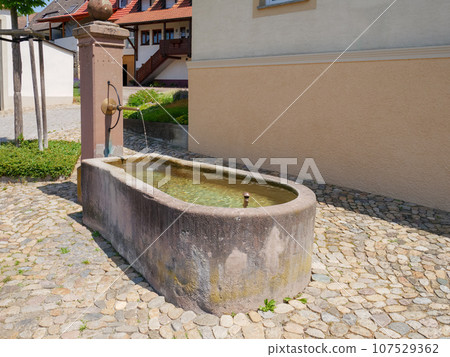 typical fountain at a south germany village typical fountain at a south germany village 107529362