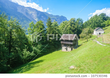 idyllic farmhouse in the swiss alps idyllic farmhouse in the swiss alps 107530346