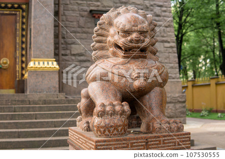 stone statue of a lion at the entrance to the Buddhist datsan Gunzechoinei stone statue of a lion at the entrance to the Buddhist datsan Gunzechoinei 107530555