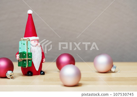 Christmas decoration with Santa Claus figure and some glass balls Christmas decoration with Santa Claus figure and some glass balls 107530745
