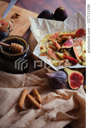 figs camembert cheese and honey figs camembert cheese and honey 107531096