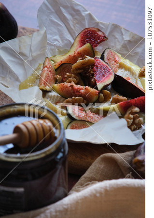 figs camembert cheese and honey figs camembert cheese and honey 107531097