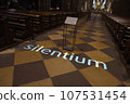 the word silentium projected on the floor of a church 107531454