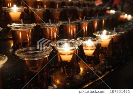 some candles in the church 107531455