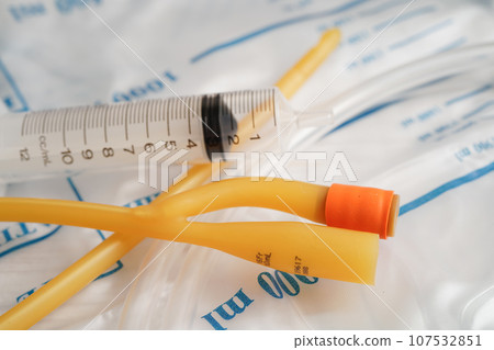 Foley catheter and urine drainage bag collect urine for disability or patient in hospital. Foley catheter and urine drainage bag collect urine for disability or patient in hospital. 107532851