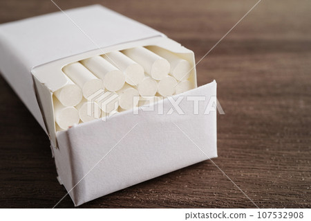 Cigarette in pack, roll tobacco in paper with filter tube, No smoking concept. Cigarette in pack, roll tobacco in paper with filter tube, No smoking concept. 107532908