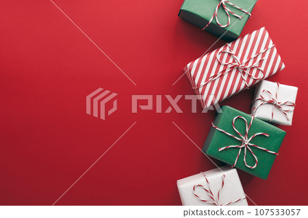 Gift boxes on color background, flat lay, space for text Gift boxes on color background, flat lay, space for text 107533057