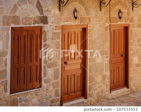 Cute details of windows, doors, balconies from old house in Simi island . Greece islands holidays from Rhodos in Aegean Sea. Colorful neoclassical houses in bay of Symi. Holiday travel background. Cute details of windows, doors, balconies from old house in Simi island . Greece islands holidays from Rhodos in Aegean Sea. Colorful neoclassical houses in bay of Symi. Holiday travel background. 107533353
