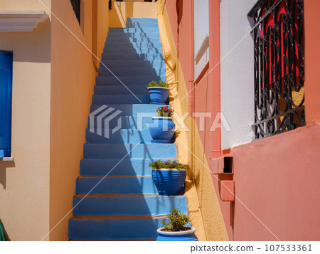 Cute details of windows, doors, balconies from old house in Simi island . Greece islands holidays from Rhodos in Aegean Sea. Colorful neoclassical houses in bay of Symi. Holiday travel background. Cute details of windows, doors, balconies from old house in Simi island . Greece islands holidays from Rhodos in Aegean Sea. Colorful neoclassical houses in bay of Symi. Holiday travel background. 107533361