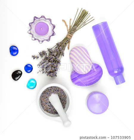 Dry herb and lavender seeds, scented candles, soap and lavender oil on white background. 107533905