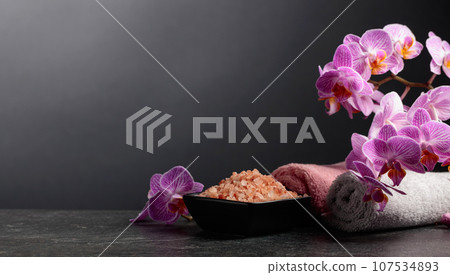 Beautiful blooming orchid flowers and pink sea salt. Beautiful blooming orchid flowers and pink sea salt. 107534893