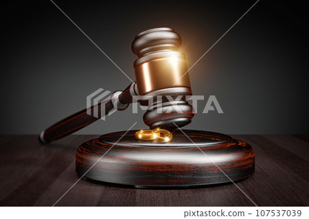 Divorce concept, wedding rings and wooden gavel. Closeup view of wedding rings on wooden mallet at table in courtroom. 3d render 107537039