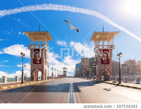 Stanley Bridge of Alexandria, view on the famous towers on the promenade, Egypt 107538381