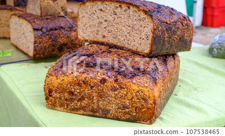 Whole wheat bread baked at home, bio ingredients, very healthy with seeds at the farmer's market 107538465
