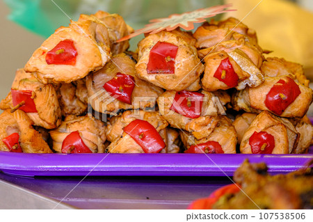 Close-up of grilled salmon and vegetable kebab. Grilled salmon skewers at the Home Makers Market 107538506