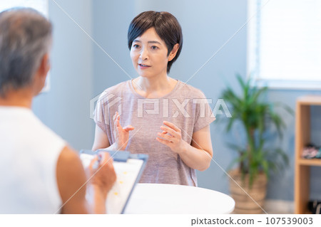 Middle-aged woman receiving counseling 107539003