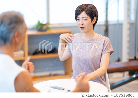 Middle-aged woman receiving counseling 107539005