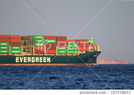 Container ship leaving port 107539631
