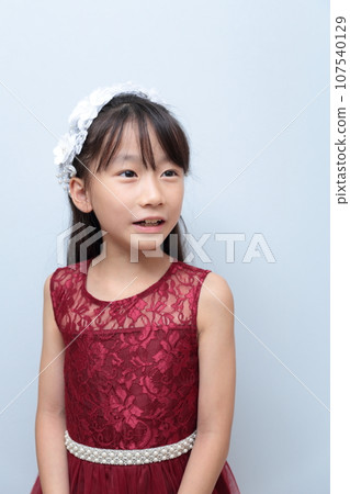 Elementary school girl in a dress Elementary school girl in a dress 107540129