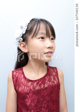 Elementary school girl in a dress Elementary school girl in a dress 107540130