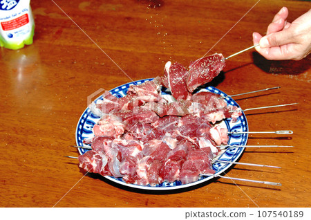 I skewered deer meat at camp. 107540189