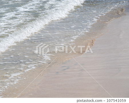 Beach on the sandy beach of the transparent sea. Beach on the sandy beach of the transparent sea. 107541059