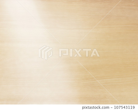 A background image of a delicate bright white wood-grained desk top with light shining diagonally from the upper left. 107543119