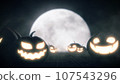 Pumpkins face light on wood with moon in dark night, Halloween spooky background 107543296