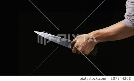 man's hand holding a knife man's hand holding a knife 107544268