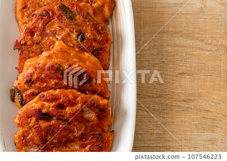 Korean Kimchi pancake or Kimchijeon - Fried Mixed Egg, Kimchi, and Flour 107546223