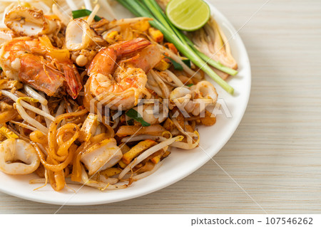 Pad Thai Seafood - Stir fried noodles with shrimps, squid or octopus and tofu Pad Thai Seafood - Stir fried noodles with shrimps, squid or octopus and tofu 107546262