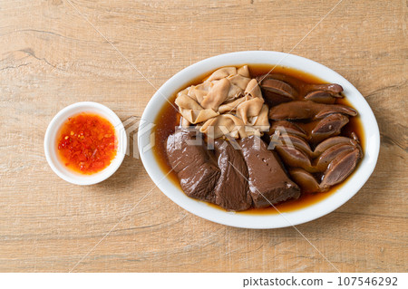 stewed duck offal in brown soup stewed duck offal in brown soup 107546292