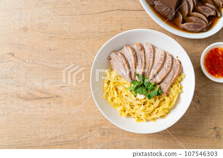 dried duck noodles in white bowl dried duck noodles in white bowl 107546303