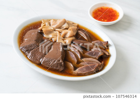 stewed duck offal in brown soup 107546314