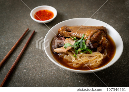 Braised duck noodles with brown soup 107546361
