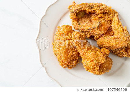 fried chicken with ketchup on plate 107546506
