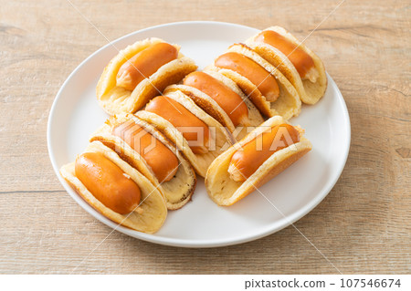 flat pancake roll with sausage flat pancake roll with sausage 107546674