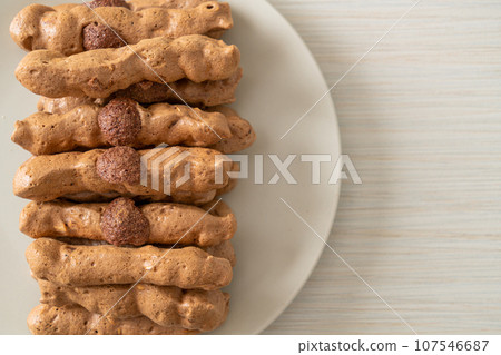 chocolate meringue stick on plate chocolate meringue stick on plate 107546687