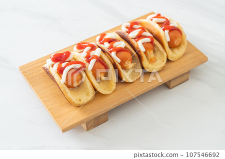 flat pancake roll with sausage 107546692
