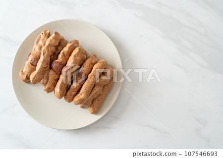 chocolate meringue stick on plate chocolate meringue stick on plate 107546693