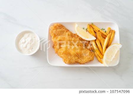 fish and chips - fried fish fillet with potatoes chips 107547096